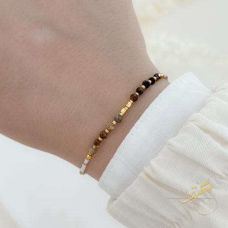 اسوارة باحجار بالوان البني والابيض والذهبي