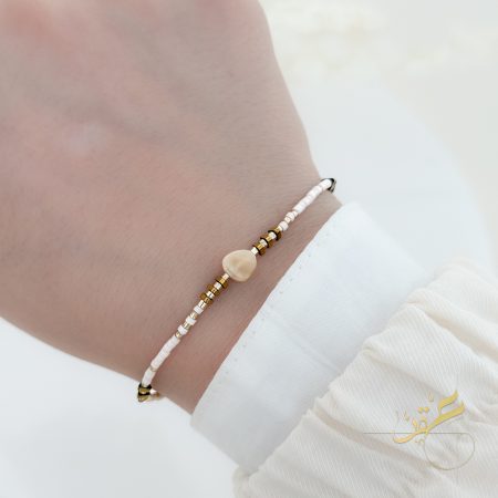 اسوارة مع حجر لون بيج والابيض