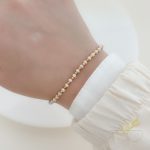 اسوارة مع احجار لون بيج وذهبي