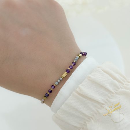 اسوارة مع احجار لون بنفسجي مع ذهبي