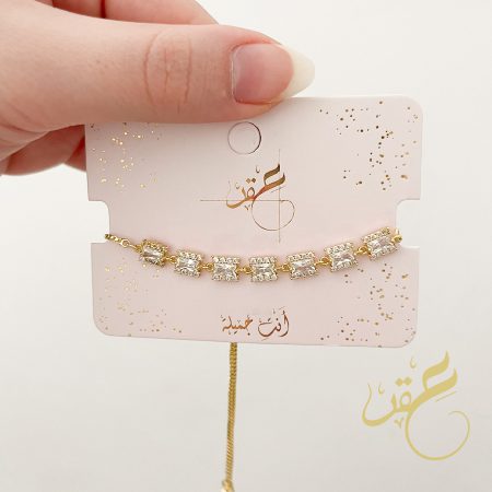 اسوارة باشكال مستطيلة محجرة باللون الذهبي مع تسكيرة سحاب